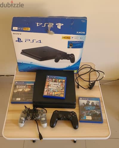 Ps4 slim 1TB with 2 controllers and 3 games in CD form