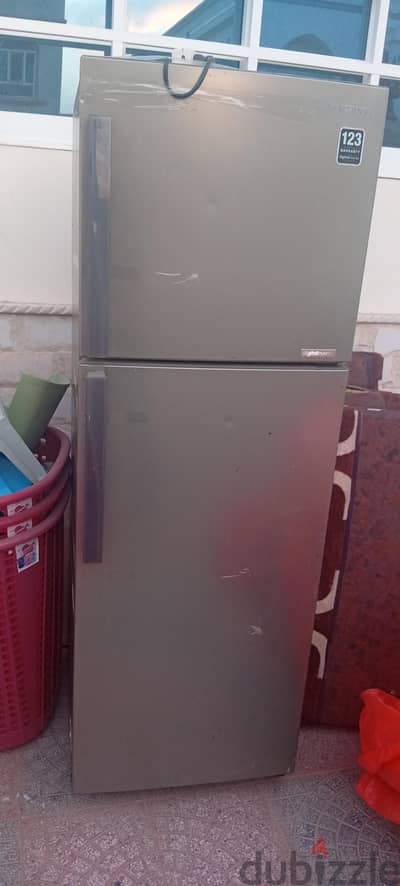 Refrigerator and oven-stove for sale, including a gas cylinder.
