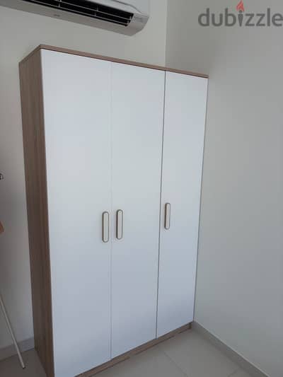 Two beds with wardrobe