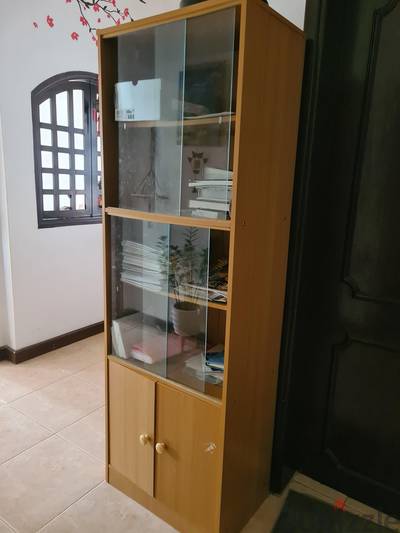 book shelf with glass closure