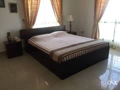 super king size bed set with 2 side tables and a dresser.