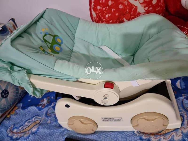 baby swing trolly- with security lock only 2 months used 1