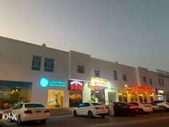 Shops in Al Khoudh main Street next to high brand cafes and restaurant