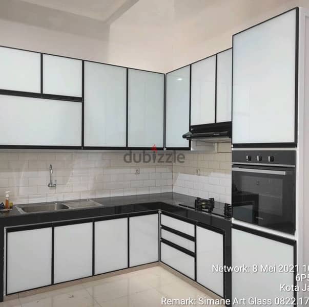 kitchen cabinets with aluminium, glass and glidding sheet 9