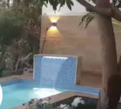 swimming pool with water fall 0