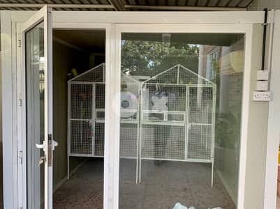 Air conditioned Aviary with birds and two cages for sale